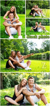      / Young couple resting in nature - Raster clipart